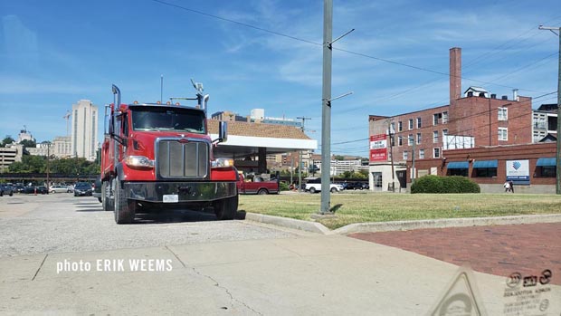 Now Leasing sign and truck on Richmond skyline